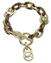 Turtle power. Tortoise-shell acetate links combine with gold tone mixed metal details and a toggle clasp on this Michael Kors bracelet. Approximate length: 8-1/2 inches. Turtle power. Tortoise-shell acetate links combine with gold tone mixed metal details and a toggle clasp on this Michael Kors bracelet. Approximate length: 8-1/2 inches.