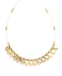 Shake up your style in rich metallics. This effortlessly elegant necklace by Nine West features polished, gold tone mixed metal discs strung from a delicate beaded chain. Approximate length: 16 inches. Shake up your style in rich metallics. This effortlessly elegant necklace by Nine West features polished, gold tone mixed metal discs strung from a delicate beaded chain. Approximate length: 16 inches.