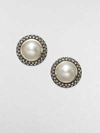 From the Mooonlight Ice Collection. A lustrous white mabe pearl sits center with a dazzling, two-row diamond surround. White mabe pearlDiamonds, .72 tcwBlackened sterling silverSize, about ½Post backImported From the Mooonlight Ice Collection. A lustrous white mabe pearl sits center with a dazzling, two-row diamond surround. White mabe pearlDiamonds, .72 tcwBlackened sterling silverSize, about ½Post backImported