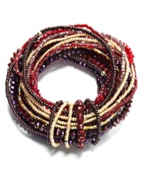Intricately intertwined. A complex array of beading (including bugle beads, seed beads and glass rondelles) embellishes this stylish stretch bracelet from c.A.K.e. by Ali Khan. Featuring a rich fall palette of reds and browns, the stretch design lets it slip on and off with ease. Approximate diameter: 2-1/4 inches. Intricately intertwined. A complex array of beading (including bugle beads, seed beads and glass rondelles) embellishes this stylish stretch bracelet from c.A.K.e. by Ali Khan. Featuring a rich fall palette of reds and browns, the stretch design lets it slip on and off with ease. Approximate diameter: 2-1/4 inches.