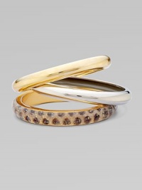A bold set of 14k plated metal and resin covered bangles to stack along the wrist.Resin covered skin 14k plated Total width, about 2½ Made in USA Please note: Pattern may vary. A bold set of 14k plated metal and resin covered bangles to stack along the wrist.Resin covered skin 14k plated Total width, about 2½ Made in USA Please note: Pattern may vary.