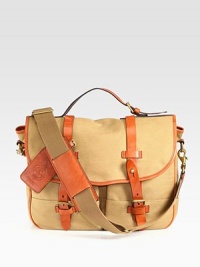 The iconic messenger bag is granted laid-back luxury from a burnished saddle-leather double-buckle closure and an embossed signature leather luggage tag for a sharp finish.Flap closureTop handleAdjustable, removable shoulder strapExterior slip, patch pocketsInterior zip pocketEmbossed signature leather luggage tagAccented with antiqued brass hardware and burnished leather trim.Canvas15W x 12H x 5DImported The iconic messenger bag is granted laid-back luxury from a burnished saddle-leather double-buckle closure and an embossed signature leather luggage tag for a sharp finish.Flap closureTop handleAdjustable, removable shoulder strapExterior slip, patch pocketsInterior zip pocketEmbossed signature leather luggage tagAccented with antiqued brass hardware and burnished leather trim.Canvas15W x 12H x 5DImported