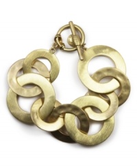 Add a bold, graphic element to your look with Jones New York's goldtone interlocking circles bracelet. Crafted in gold-plated mixed metal. Approximate length: 7 inches. Add a bold, graphic element to your look with Jones New York's goldtone interlocking circles bracelet. Crafted in gold-plated mixed metal. Approximate length: 7 inches.