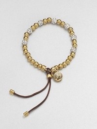 A radiant goldtone beaded design accented with rhinestone encrusted beads and a supple leather closure. Goldtone steel and brassGlass stonesDiameter, about 2.25 adjustableBeaded leather closureImported A radiant goldtone beaded design accented with rhinestone encrusted beads and a supple leather closure. Goldtone steel and brassGlass stonesDiameter, about 2.25 adjustableBeaded leather closureImported