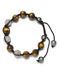 Spiritual-inspired bracelets are all the rage this season! Snap up this hot style from Ali Khan featuring semi-precious tiger's eye beads and pave glass fireballs on a trendy black cord. Bracelet adjusts to fit the wrist. Approximate diameter: 2 inches. Approximate length: 12-1/4 inches. Spiritual-inspired bracelets are all the rage this season! Snap up this hot style from Ali Khan featuring semi-precious tiger's eye beads and pave glass fireballs on a trendy black cord. Bracelet adjusts to fit the wrist. Approximate diameter: 2 inches. Approximate length: 12-1/4 inches.