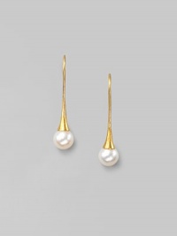 Delicate freshwater pearls dangle from hand-hammered 24k gold settings. 8mm white, round freshwater pearls 24k yellow gold Length, about 1¼ 22k gold ear wire Imported Delicate freshwater pearls dangle from hand-hammered 24k gold settings. 8mm white, round freshwater pearls 24k yellow gold Length, about 1¼ 22k gold ear wire Imported