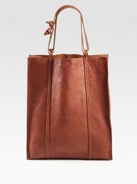 Gorgeous washed leather in a chic tote, roomy enough for all your essentials.Adjustable shoulder straps, 8-16 dropTop tie closureOne inside zip pocketOne inside open pocketCotton lining14W X 17H X 5DMade in Italy Gorgeous washed leather in a chic tote, roomy enough for all your essentials.Adjustable shoulder straps, 8-16 dropTop tie closureOne inside zip pocketOne inside open pocketCotton lining14W X 17H X 5DMade in Italy