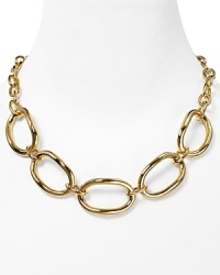 Bold gold-plated links are a sculptural statement on this Robert Lee Morris Soho necklace, lending this piece modern allure. Bold gold-plated links are a sculptural statement on this Robert Lee Morris Soho necklace, lending this piece modern allure.