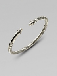 A signature Yurman cable of sterling silver, richly enhanced by bands of pavé diamonds encircling lustrous white freshwater pearl end caps. Diamonds, 0.09 tcw White freshwater pearls Sterling silver Cable, 5mm Diameter, about 2¼ Made in USA A signature Yurman cable of sterling silver, richly enhanced by bands of pavé diamonds encircling lustrous white freshwater pearl end caps. Diamonds, 0.09 tcw White freshwater pearls Sterling silver Cable, 5mm Diameter, about 2¼ Made in USA