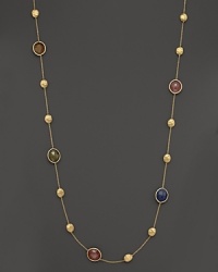 Mixed sapphires in colorful hues adorn this hand-engraved yellow gold station necklace from Marco Bicego. Mixed sapphires in colorful hues adorn this hand-engraved yellow gold station necklace from Marco Bicego.