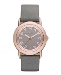 Tastefully trendy. The perfect amount of shimmer and shine accents this watch by Marc by Marc Jacobs. Metallic gray leather strap and round rose-gold ion-plated stainless steel case. Gray mirrored dial features rose-gold tone logo letters at markers and three hands. Quartz movement. Water resistant to 50 meters. Two-year limited warranty. Tastefully trendy. The perfect amount of shimmer and shine accents this watch by Marc by Marc Jacobs. Metallic gray leather strap and round rose-gold ion-plated stainless steel case. Gray mirrored dial features rose-gold tone logo letters at markers and three hands. Quartz movement. Water resistant to 50 meters. Two-year limited warranty.