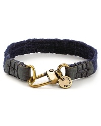 Leather and brasstone hardware bring a city edge to this canvas bracelet from Caputo. Leather and brasstone hardware bring a city edge to this canvas bracelet from Caputo.