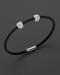 From the Celtic Noir Collection, a stackable bangle in white gold and and black PVD with diamond stations. Designed by Charriol. From the Celtic Noir Collection, a stackable bangle in white gold and and black PVD with diamond stations. Designed by Charriol.