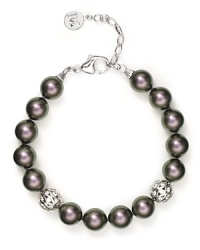 Classic and sophisticated, this Majorica bracelet features cultured Tahitian pearls with sparkling crystal details. Classic and sophisticated, this Majorica bracelet features cultured Tahitian pearls with sparkling crystal details.