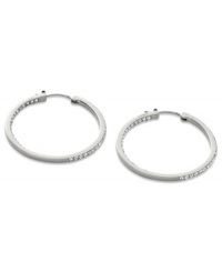 Go full-blitz with these glitzy hoop earrings from Fossil. The classic design is amped up with clear pave crystal accents. Crafted in polished stainless steel. Approximate diameter: 1-3/8 inches. Go full-blitz with these glitzy hoop earrings from Fossil. The classic design is amped up with clear pave crystal accents. Crafted in polished stainless steel. Approximate diameter: 1-3/8 inches.