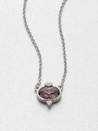 A beautifully faceted raspberry crystal stone set in intricately designed, sterling silver accented with a dazzling white sapphire on a link chain. Raspberry crystalSterling silverWhite sapphireLength , about 17Pendant size, .6Lobster clasp closureImported