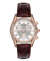 Luxury in every majestic detail. Watch by Bulova crafted of brown croc-embossed leather strap and round rose-gold-plated stainless steel case with diamond-accented bezel. Mother-of-pearl chronograph dial with silver tone center dial features diamond accents and stick indices at markers, minute track, date window at four o'clock, three subdials, luminous rose-gold tone hands and logo. Quartz movement. Water resistant to 30 meters. Three-year limited warranty. Luxury in every majestic detail. Watch by Bulova crafted of brown croc-embossed leather strap and round rose-gold-plated stainless steel case with diamond-accented bezel. Mother-of-pearl chronograph dial with silver tone center dial features diamond accents and stick indices at markers, minute track, date window at four o'clock, three subdials, luminous rose-gold tone hands and logo. Quartz movement. Water resistant to 30 meters. Three-year limited warranty.