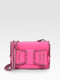 An ultra-feminine design trimmed with grommets and studs and embellished with a large bow.Adjustable chain and leather shoulder strap, 11½ or 21 dropMagnetic snap flap closureThree inside open pocketsCotton lining9W X 6½H X 2½DImported An ultra-feminine design trimmed with grommets and studs and embellished with a large bow.Adjustable chain and leather shoulder strap, 11½ or 21 dropMagnetic snap flap closureThree inside open pocketsCotton lining9W X 6½H X 2½DImported
