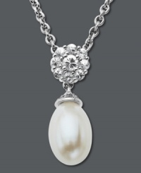 Sweet sophistication. Round-cut white topaz (6-1/2 ct. t.w.) and a cultured freshwater pearl (8 mm x 12 mm) form an elegant shape on this sterling silver drop pendant. Approximate length: 18 inches. Approximate drop: 9/10 inch. Sweet sophistication. Round-cut white topaz (6-1/2 ct. t.w.) and a cultured freshwater pearl (8 mm x 12 mm) form an elegant shape on this sterling silver drop pendant. Approximate length: 18 inches. Approximate drop: 9/10 inch.