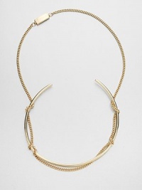 An artful statement, conceived to catch the eye with a simple tubular collar wrapped up in a bold chain.BrassLength, about 28Drop, about 5Push-lock claspMade in Italy An artful statement, conceived to catch the eye with a simple tubular collar wrapped up in a bold chain.BrassLength, about 28Drop, about 5Push-lock claspMade in Italy