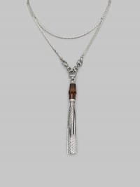 A bamboo bead and sterling silver tassels drop elegantly from a modern, snake-inspired chain with horsebit details. Bamboo Sterling silver Length around neck, about 43 Made in Italy A bamboo bead and sterling silver tassels drop elegantly from a modern, snake-inspired chain with horsebit details. Bamboo Sterling silver Length around neck, about 43 Made in Italy