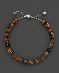 Bamboo and tigerseye beads make a natural pairing on this timeless Gucci bracelet. Bamboo and tigerseye beads make a natural pairing on this timeless Gucci bracelet.