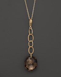 Oval freeform smoky quartz briolettes add rich sparkle to links of 14K yellow gold. By Nancy B. Oval freeform smoky quartz briolettes add rich sparkle to links of 14K yellow gold. By Nancy B.