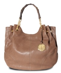 Poised and practical, this slouchy silhouette from Vince Camuto offers a touch of elegance to any ensemble. Luxurious leather is elegantly accented with custom hardware and chain-link stations at the straps, while the spacious interior provides plenty of pockets for the everyday essentials. Poised and practical, this slouchy silhouette from Vince Camuto offers a touch of elegance to any ensemble. Luxurious leather is elegantly accented with custom hardware and chain-link stations at the straps, while the spacious interior provides plenty of pockets for the everyday essentials.