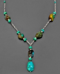 Accent any outfit with the radiant hue of turquoise. This earthy necklace combines sterling silver and rustic turquoise stones in with natural splendor. Measures approximately 18 inches long. Approximate drop: 2 inches. Accent any outfit with the radiant hue of turquoise. This earthy necklace combines sterling silver and rustic turquoise stones in with natural splendor. Measures approximately 18 inches long. Approximate drop: 2 inches.