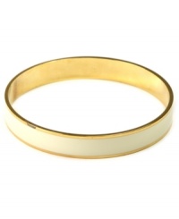 Refined and polished. This versatile piece by Anne Klein pairs perfectly with other bangles for a trendy, layered look. Crafted in gold tone mixed metal with an ivory enamel stripe. Approximate diameter: 2-1/2 inches. Refined and polished. This versatile piece by Anne Klein pairs perfectly with other bangles for a trendy, layered look. Crafted in gold tone mixed metal with an ivory enamel stripe. Approximate diameter: 2-1/2 inches.