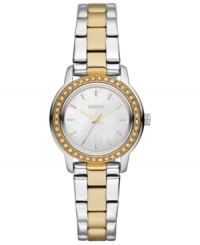 Golden accents and swirling rings of crystal accents prettify this classic steel watch from DKNY. Golden accents and swirling rings of crystal accents prettify this classic steel watch from DKNY.