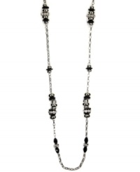 Define your style. This bold, beaded necklace by Nine West highlights plastic jet and clear bead stations strung from a silver tone mixed metal chain. Approximate length: 48 inches. Define your style. This bold, beaded necklace by Nine West highlights plastic jet and clear bead stations strung from a silver tone mixed metal chain. Approximate length: 48 inches.
