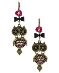 All eyes will be on you with these whimsical owl drop earrings from Betsey Johnson. Crafted from gold-tone mixed metal, the earrings feature glass crystal accents in shades of purple for a colorful touch. Approximate drop: 2-1/2 inches. All eyes will be on you with these whimsical owl drop earrings from Betsey Johnson. Crafted from gold-tone mixed metal, the earrings feature glass crystal accents in shades of purple for a colorful touch. Approximate drop: 2-1/2 inches.
