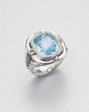From the Labyrinth Collection. A stunning, faceted blue topaz stone surrounded by sparkling diamonds set in sleek sterling silver on an iconic double cable shank. Blue topazDiamonds, .2 tcwSterling silverWidth, about .6Imported 