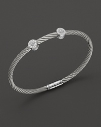 From the Classique Collection, a stackable bangle in white gold and stainless steel with diamond stations. Designed by Charriol. From the Classique Collection, a stackable bangle in white gold and stainless steel with diamond stations. Designed by Charriol.
