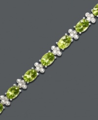 Inspired by spring. This light and airy tennis bracelet features gleaming oval-cut peridot (14 ct. t.w.) alongside diamond-accented links. Crafted in sterling silver. Approximate length: 7 inches. Inspired by spring. This light and airy tennis bracelet features gleaming oval-cut peridot (14 ct. t.w.) alongside diamond-accented links. Crafted in sterling silver. Approximate length: 7 inches.