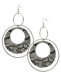 Ravishingly reptilian. These double ring hoop earrings from GUESS take an exotic turn with black and white python print at the inner pendant. Crafted in imitation rhodium-plated mixed metal. Approximate drop: 3-1/4 inches. Approximate diameter: 2-1/4 inches. Ravishingly reptilian. These double ring hoop earrings from GUESS take an exotic turn with black and white python print at the inner pendant. Crafted in imitation rhodium-plated mixed metal. Approximate drop: 3-1/4 inches. Approximate diameter: 2-1/4 inches.