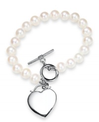 Cultured freshwater pearls (7-8 mm) get a modern update with a chic toggle clasp and polished heart charm in sterling silver. Approximate length: 7-1/2 inches. Approximate charm drop: 1 inch. Cultured freshwater pearls (7-8 mm) get a modern update with a chic toggle clasp and polished heart charm in sterling silver. Approximate length: 7-1/2 inches. Approximate charm drop: 1 inch.