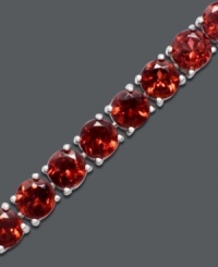 Vibrantly versatile. Ruby red stones of round-cut garnet (20 ct. t.w.) make a mark in your corporate or casual lifestyle. Bracelet crafted in sterling silver. Approximate length: 7 inches. Vibrantly versatile. Ruby red stones of round-cut garnet (20 ct. t.w.) make a mark in your corporate or casual lifestyle. Bracelet crafted in sterling silver. Approximate length: 7 inches.