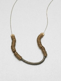 This technical, yet delicate design features clusters of sequins and nuts on a dainty link chain. Oxide-plated sequinsBrass nutsGold-filled chainLength, about 18Gold-filled S-hook closureMade in USA This technical, yet delicate design features clusters of sequins and nuts on a dainty link chain. Oxide-plated sequinsBrass nutsGold-filled chainLength, about 18Gold-filled S-hook closureMade in USA