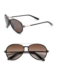 Injected frames with a timeless aviator style. Available in shiny black frames with roviex lenses and dark translucent brown frames with gradient brown lenses. 100% UV protective Made in Italy Injected frames with a timeless aviator style. Available in shiny black frames with roviex lenses and dark translucent brown frames with gradient brown lenses. 100% UV protective Made in Italy