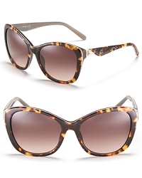 Western-inspired cat eye sunglasses with contrast interior and studded sides. Western-inspired cat eye sunglasses with contrast interior and studded sides.