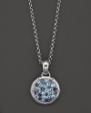 Sterling silver, jointed like a bamboo stalk, circles a glittering pavé lagoon of Swiss blue topaz and iolite gems on a pendant suspended from a delicate adjustable chain.