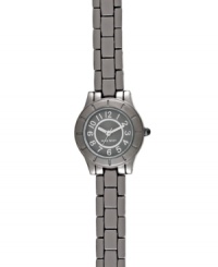 Take a page out of the menswear book with this modern watch from Nine West. Crafted of gunmetal tone mixed metal bracelet and round case with etched bezel. Gray dial with textured inner dial features silver tone numerals, hour and minute hands, sweeping second hand and logo at six o'clock. Quartz movement. Limited lifetime warranty. Take a page out of the menswear book with this modern watch from Nine West. Crafted of gunmetal tone mixed metal bracelet and round case with etched bezel. Gray dial with textured inner dial features silver tone numerals, hour and minute hands, sweeping second hand and logo at six o'clock. Quartz movement. Limited lifetime warranty.