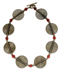 Keep your social circle envious with this collar necklace from Lauren Ralph Lauren. Textured disc pendants are displayed with red acrylic beads. Crafted in gold tone mixed metal. Approximate length: 18 inches + 2-inch extender. Keep your social circle envious with this collar necklace from Lauren Ralph Lauren. Textured disc pendants are displayed with red acrylic beads. Crafted in gold tone mixed metal. Approximate length: 18 inches + 2-inch extender.