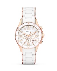 Give your hourly look a hit of MARC BY MARC JACOBS' style with this rose-gold accented watch. Equal parts sporty and sleek, it features a silicone wrapped bracelet and advanced chronograph movement. Give your hourly look a hit of MARC BY MARC JACOBS' style with this rose-gold accented watch. Equal parts sporty and sleek, it features a silicone wrapped bracelet and advanced chronograph movement.