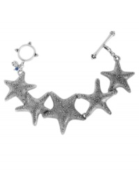 Lucky Brand's Starfish bracelet lets you take a bit of sea with you, no matter where you go. Crafted in silver tone mixed metal with a toggle clasp closure. Approximate length: 7-5/8 inches. Lucky Brand's Starfish bracelet lets you take a bit of sea with you, no matter where you go. Crafted in silver tone mixed metal with a toggle clasp closure. Approximate length: 7-5/8 inches.