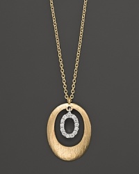 A circle of 14K. yellow gold frames a ring of diamonds. By Meira T. A circle of 14K. yellow gold frames a ring of diamonds. By Meira T.