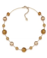Golden rules. Gold-hued glass pearls are complemented by alluring amber-colored fireball accents on Carolee's chic illusion necklace. Made in gold tone mixed metal, it will add polish to your workday wardrobe. Approximate length: 16 inches + 2-inch extender. Golden rules. Gold-hued glass pearls are complemented by alluring amber-colored fireball accents on Carolee's chic illusion necklace. Made in gold tone mixed metal, it will add polish to your workday wardrobe. Approximate length: 16 inches + 2-inch extender.