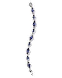 Ever-glamorous pavé crystals frame stunning sapphire stones on this modern Lora Paolo bracelet. Ever-glamorous pavé crystals frame stunning sapphire stones on this modern Lora Paolo bracelet.
